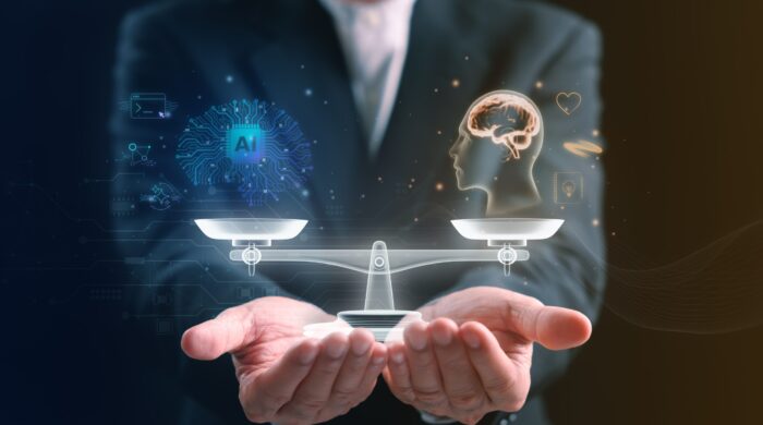 Businessman,Holding,A,Balanced,Scale,Between,Artificial,Intelligence,And,Human