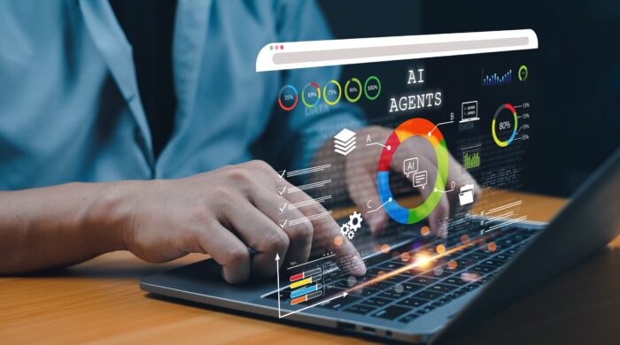 User,Analyzing,Ai,Agent,Performance,Data,On,A,Laptop,With